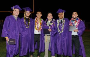 Friends gather following the commencement ceremony Thursday night in Lemoore High School's Tiger Stadium.